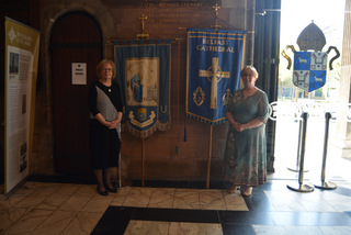 Moira, Vice-President Fundraising and Communications Unit and Diane, Cathedral branch secretary with the Diocesan and Cathedral Banners.